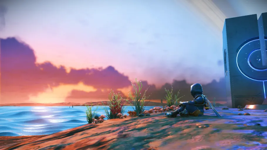 A traveller in No Man's Sky resting on a beach as the sun rises